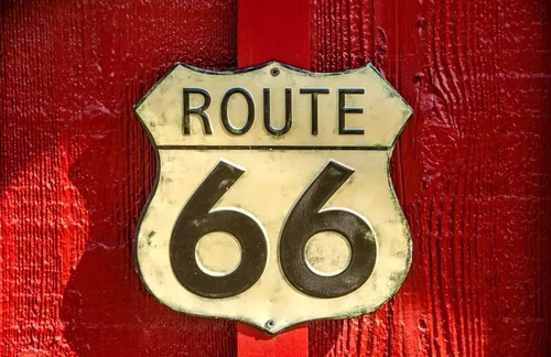 US Route 66 sign in a red building on the Mother Road.